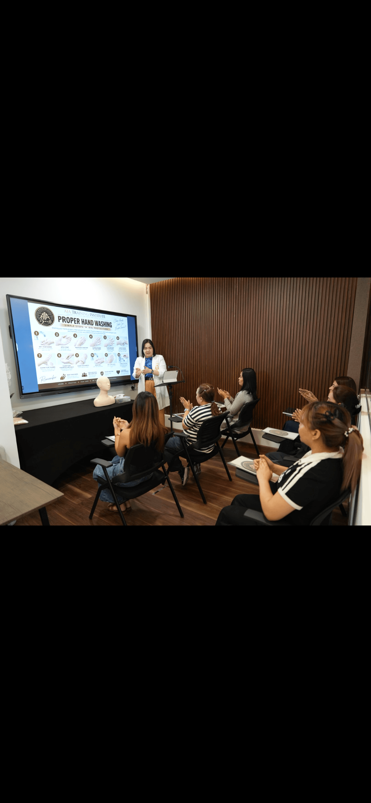 Students learning together in a beauty training class